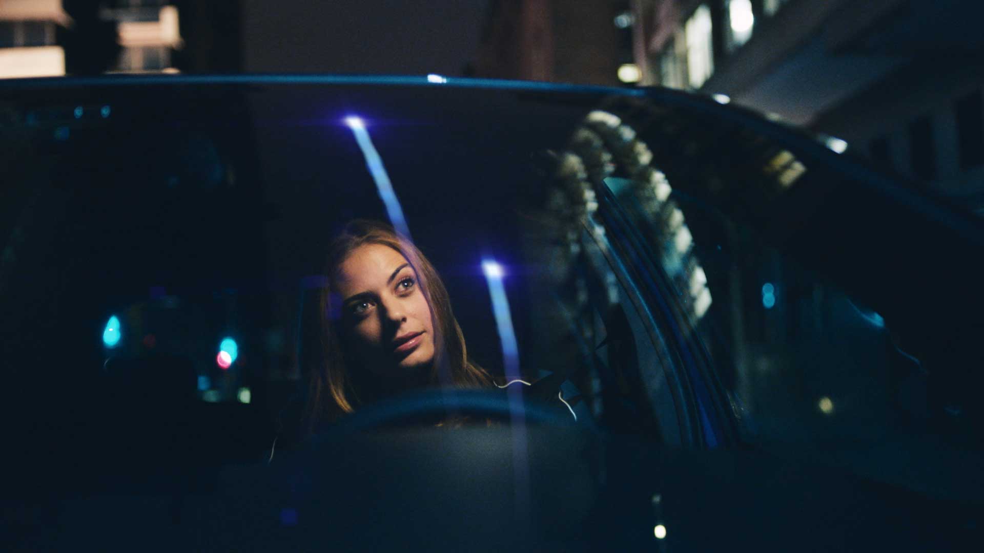 Woman in car. Still from Toyota Yaris commercial.