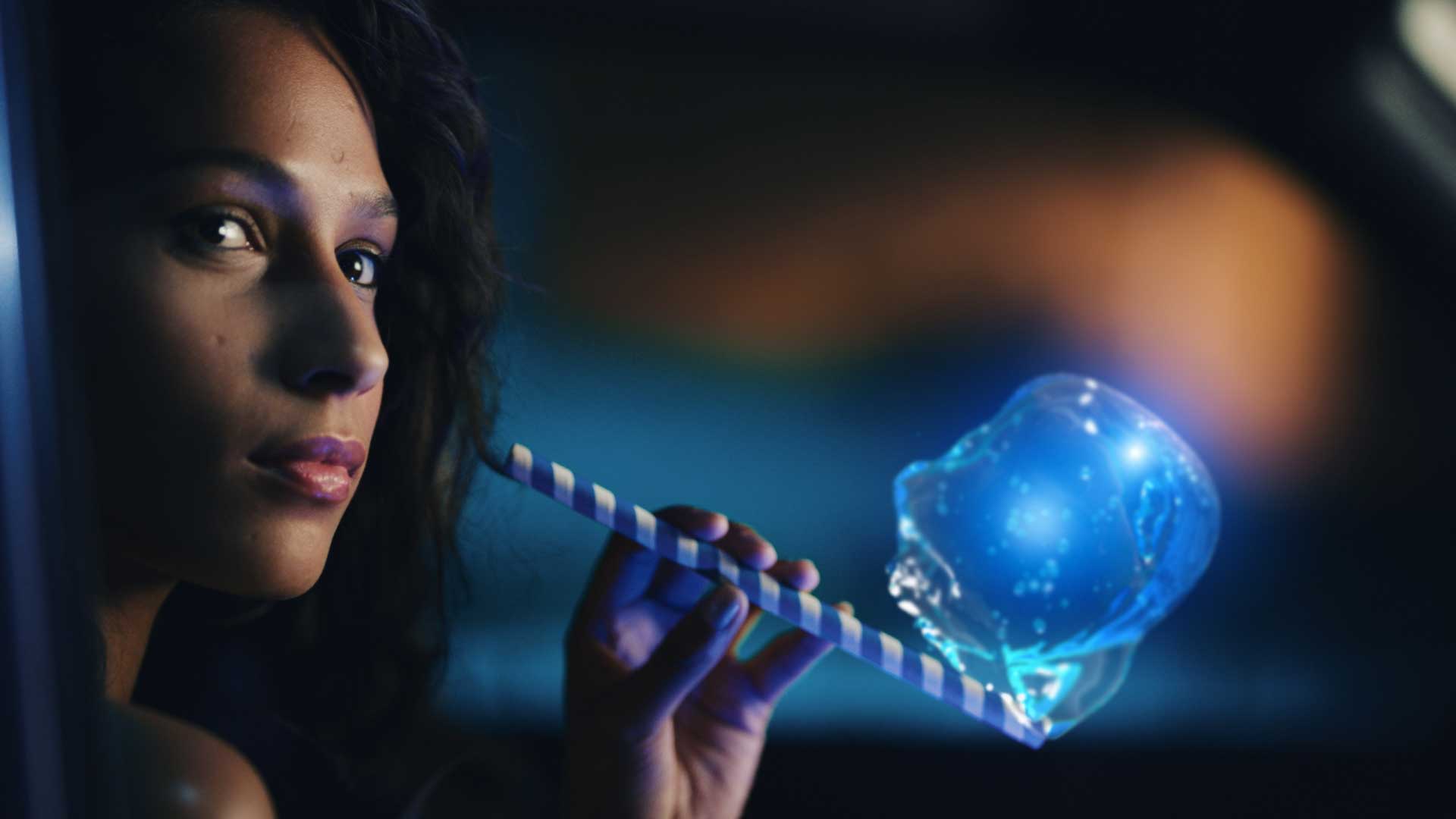 Woman with straw and bubble. Still from Toyota Yaris commercial.